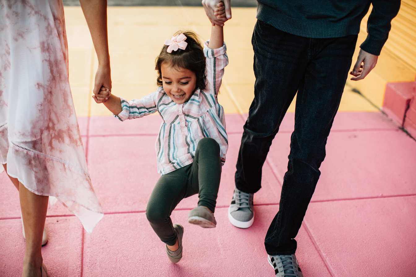 Happy Little Child Together with her Parents